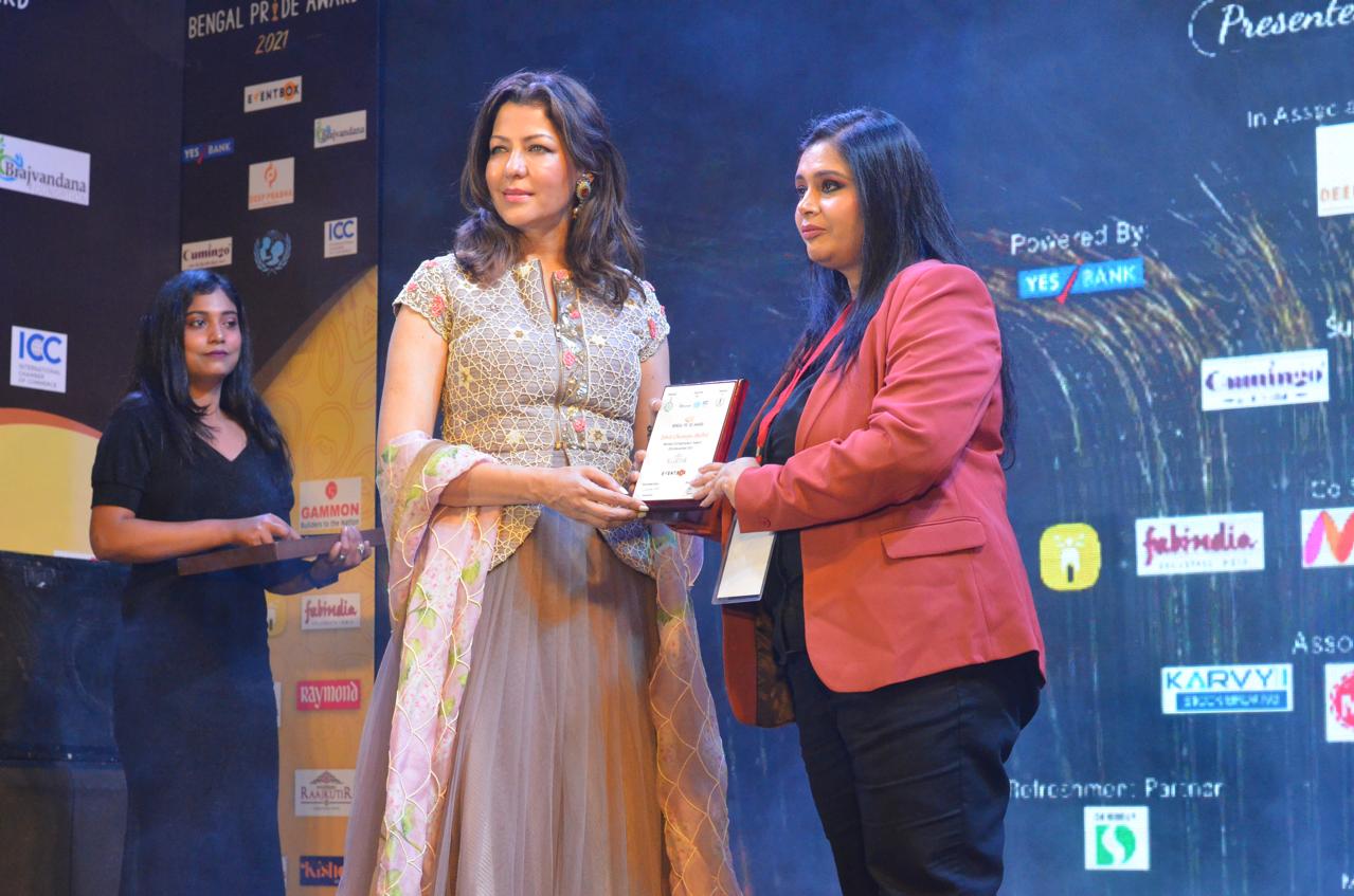 Dhriti receiving an award at the Bengal Pride Awards