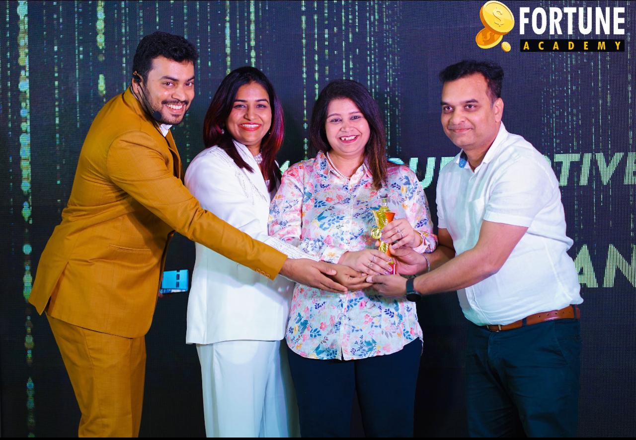 Dhriti being felicitated at a Fortune Academy event
